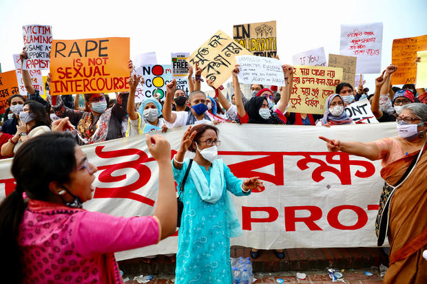 A feminist group take part in an ongoing protest demanding justice for the alleged gang rape of a woman 